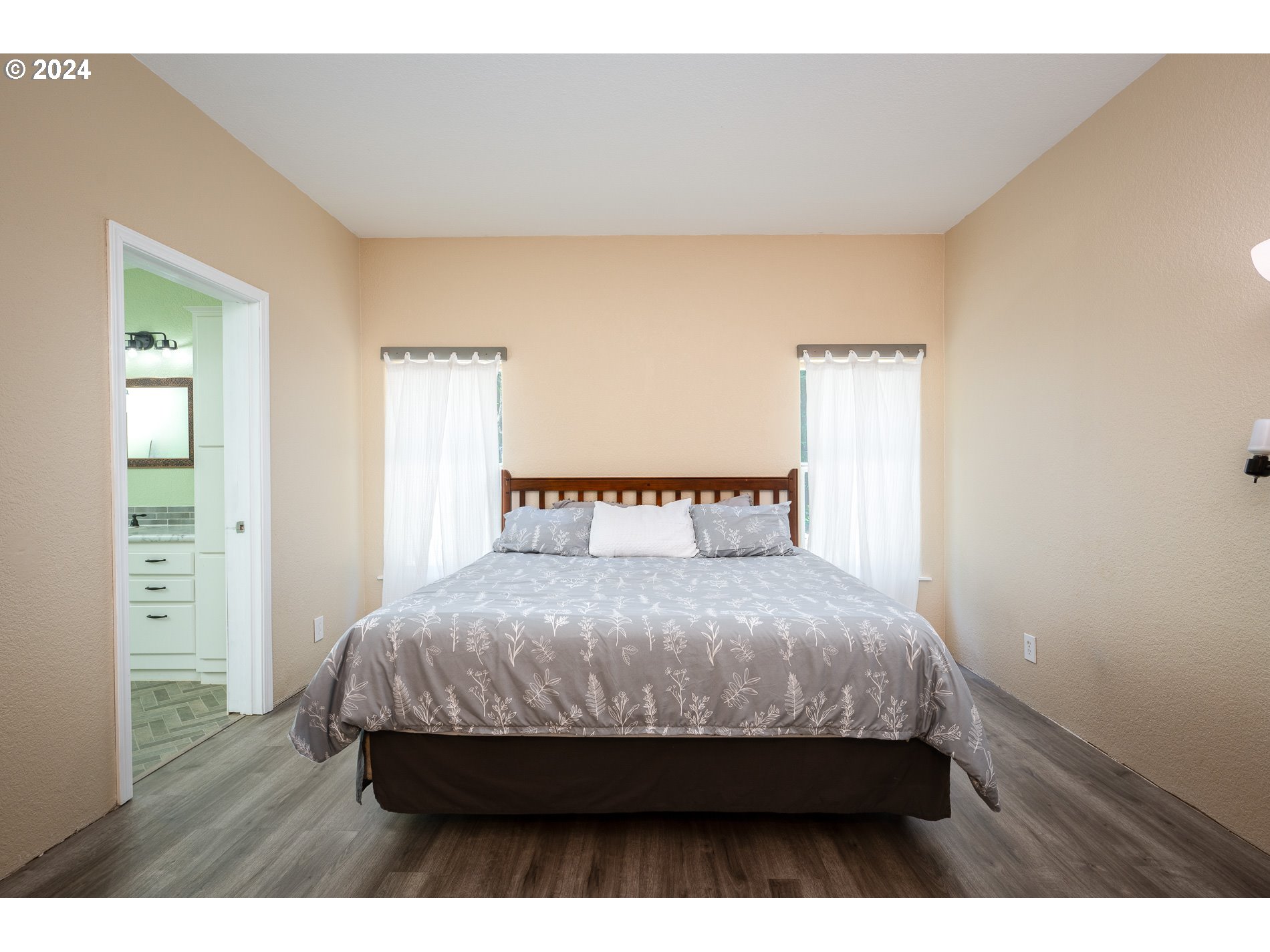 6007 Northeast Lessard Road Camas, WA 98607 - Photo 23 of 48 a bedroom with a bed and wooden floor
