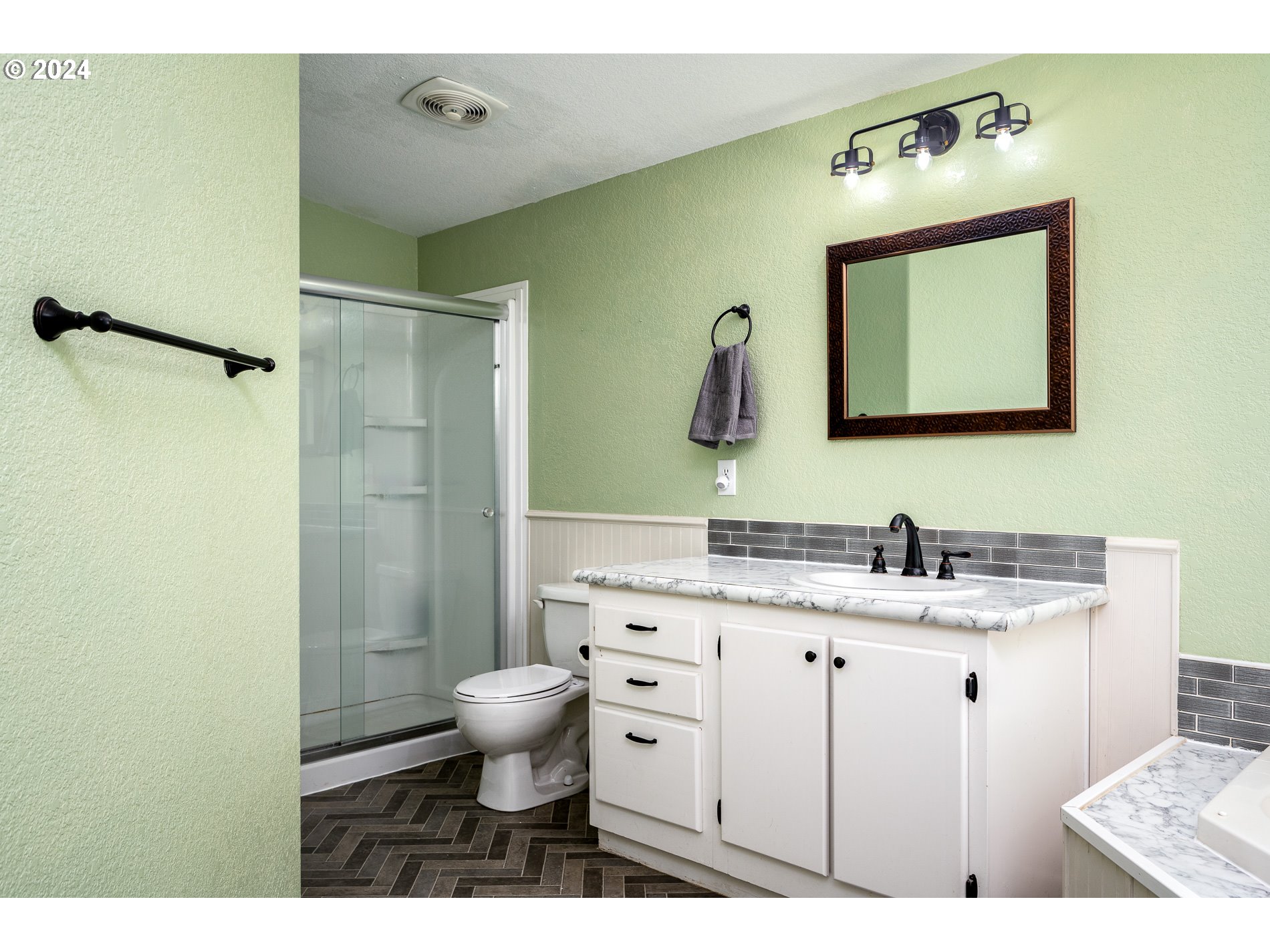 6007 Northeast Lessard Road Camas, WA 98607 - Photo 26 of 48 a bathroom with a toilet sink and mirror