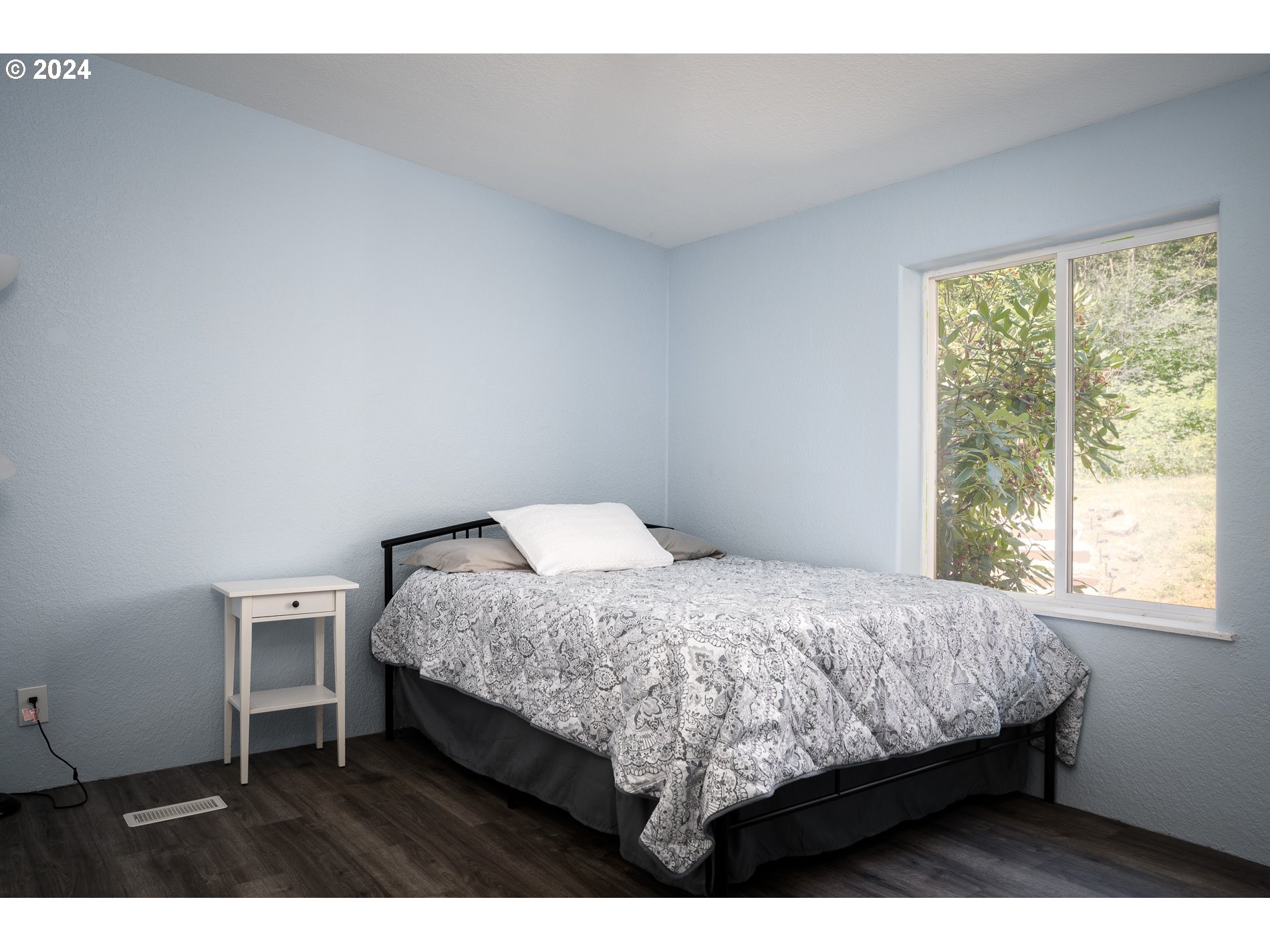 6007 Northeast Lessard Road Camas, WA 98607 - Photo 28 of 48 a bed sitting in a bedroom next to a window