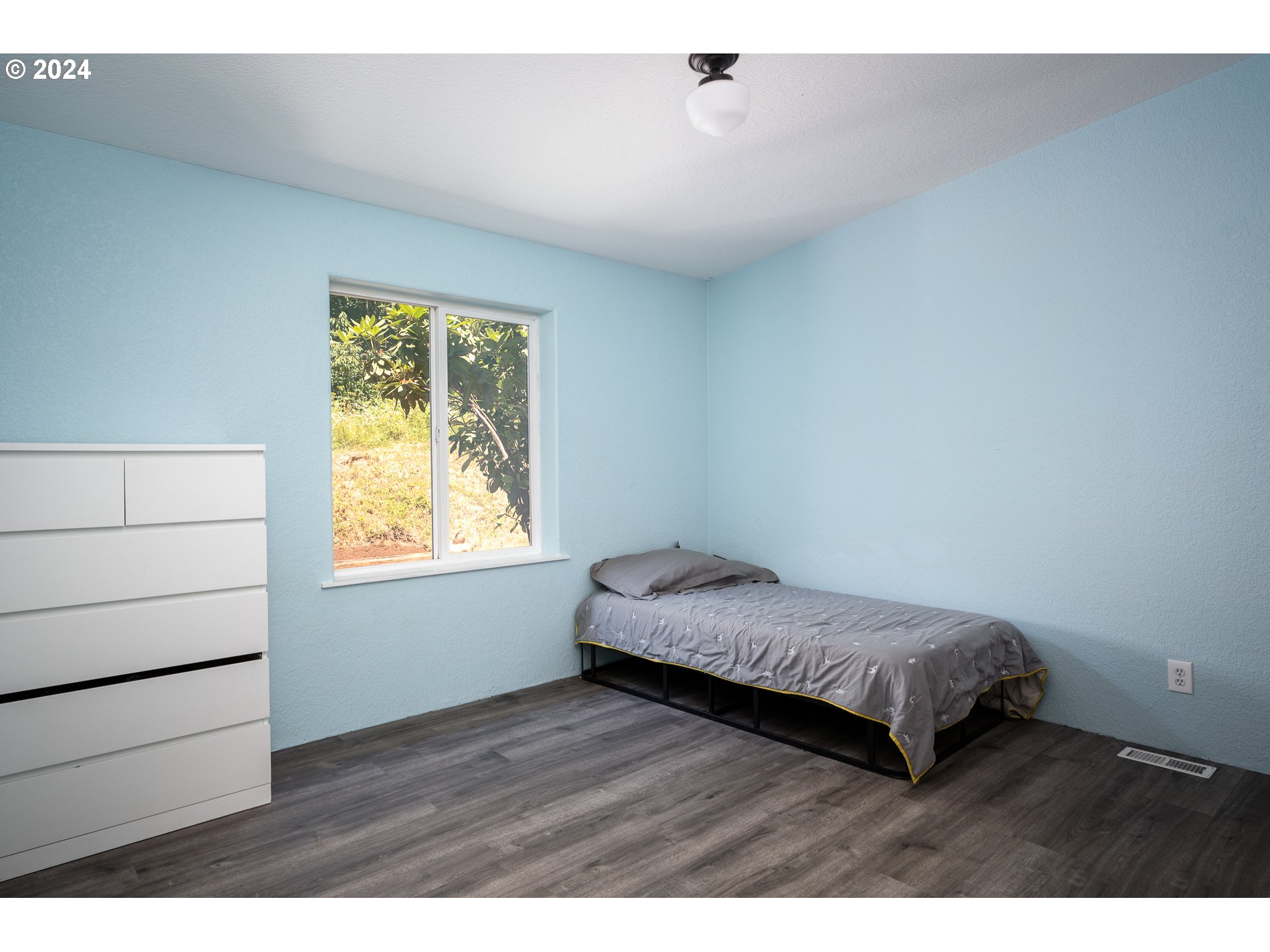 6007 Northeast Lessard Road Camas, WA 98607 - Photo 30 of 48 a bedroom with a bed and a window