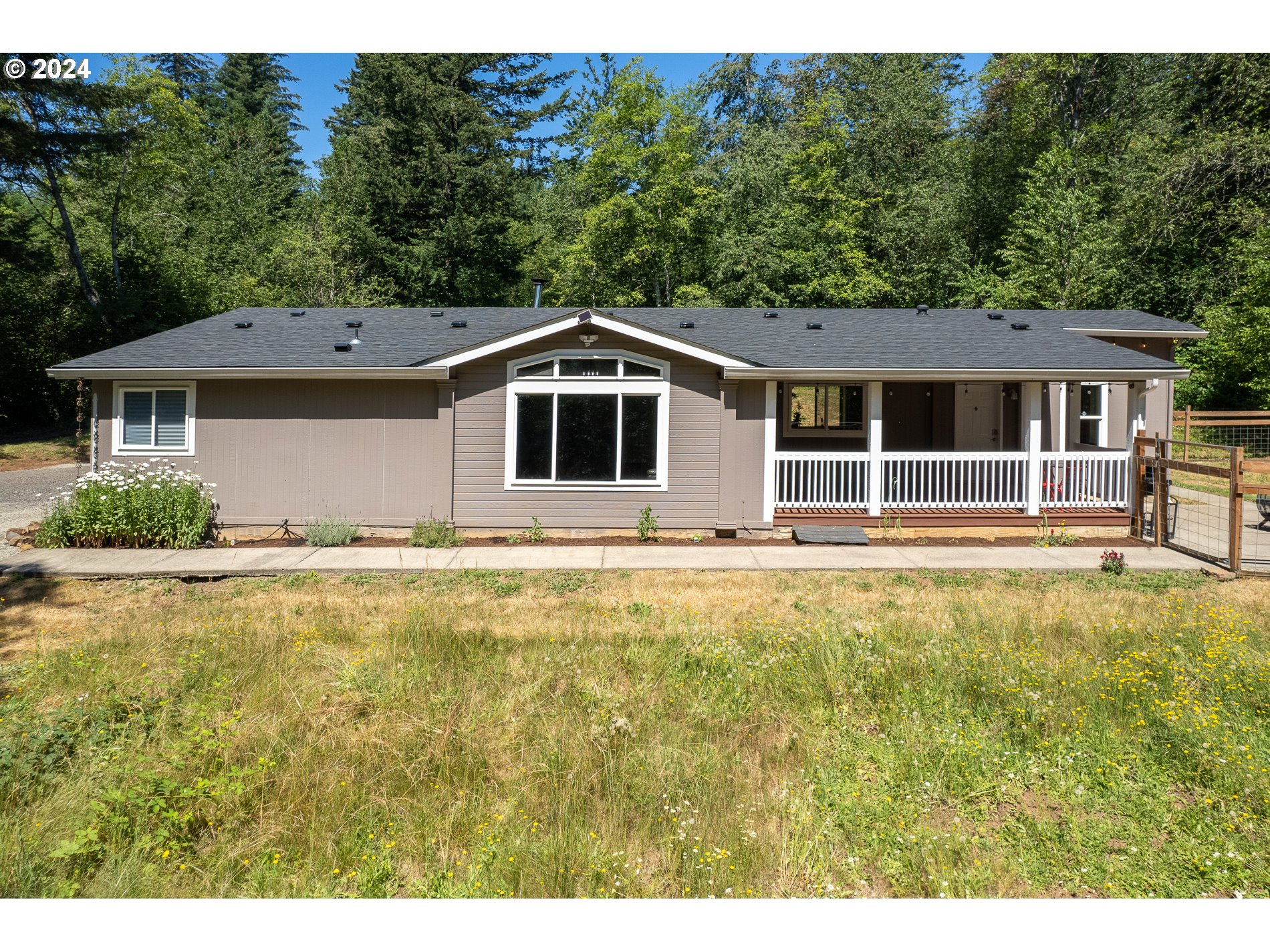6007 Northeast Lessard Road Camas, WA 98607 - Photo 3 of 48 a front view of a house with a yard