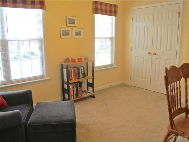 2300 Turtle Point Drive Raleigh, NC 27604 - Photo 23 of 25 Another view of the second bedroom highlighting the double door closet. Extra windows give this room a bit of extra charm! Bedroom