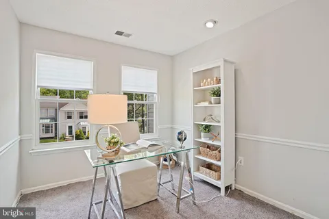 a workspace with furniture and a window