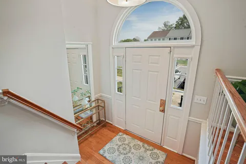 a view of a hallway with paintings on the wall