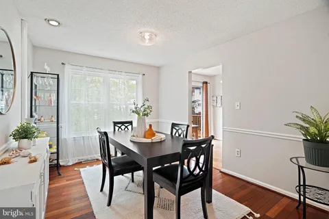 a view of a dining room with furniture and window