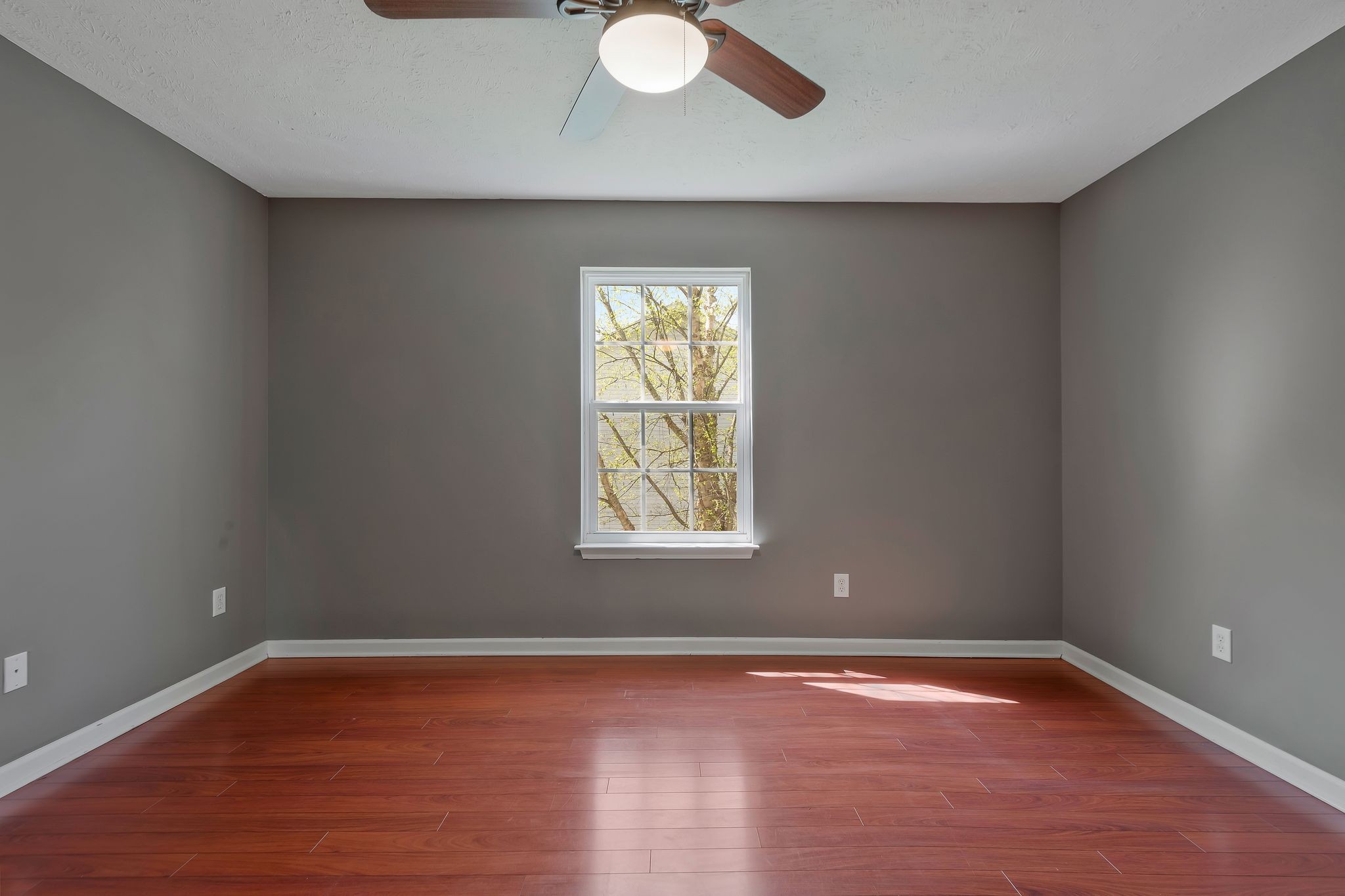1902 Portway Road Spring Hill, TN 37174 - Photo 24 of 34 a view of an empty room with wooden floor and a window