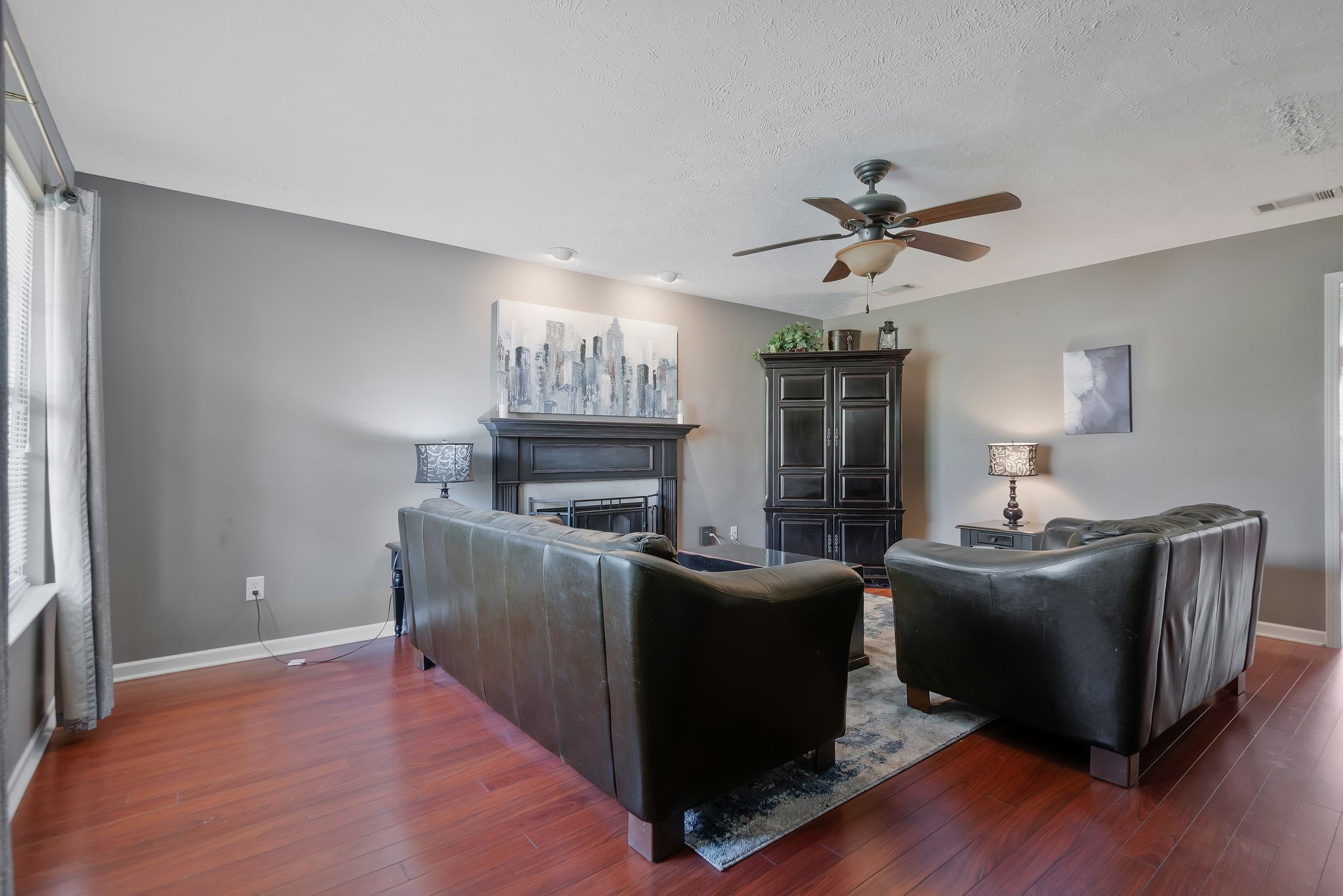 1902 Portway Road Spring Hill, TN 37174 - Photo 6 of 34 a living room with furniture and a fireplace