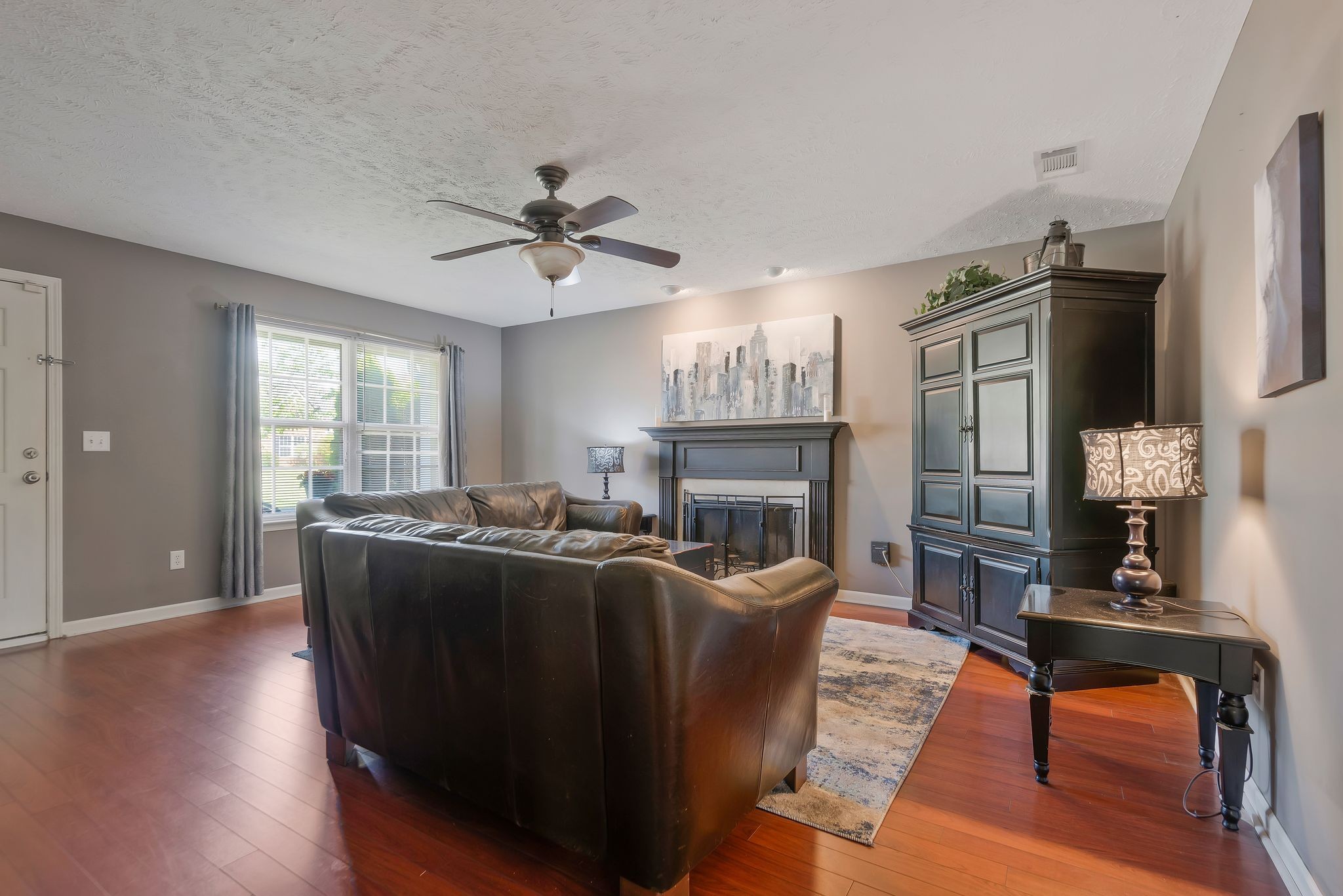 1902 Portway Road Spring Hill, TN 37174 - Photo 8 of 34 a living room with furniture a fireplace and a flat screen tv