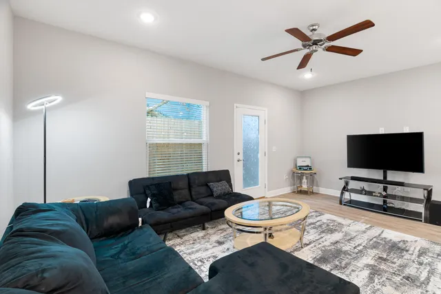 a living room with furniture and a flat screen tv