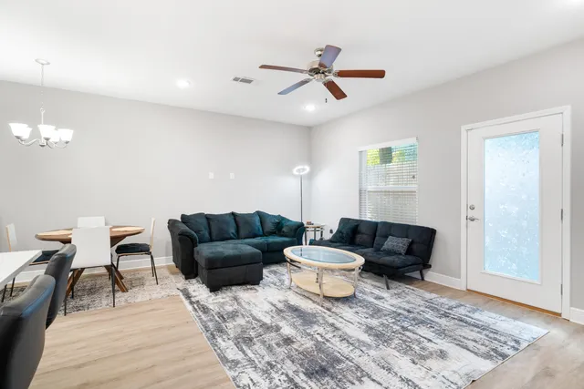 a living room with furniture and a rug