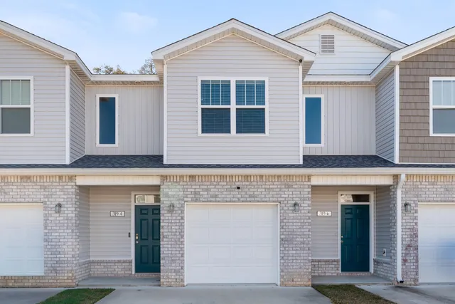 a front view of a house with yard
