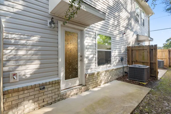 a view of a entryway door of the house with outdoor space