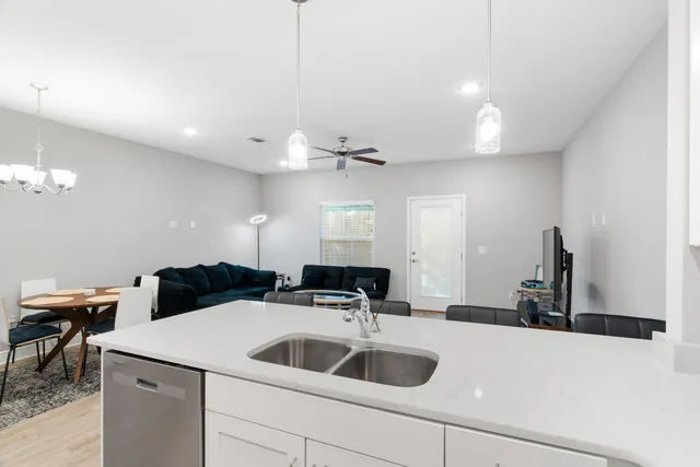 a kitchen with a sink and a refrigerator