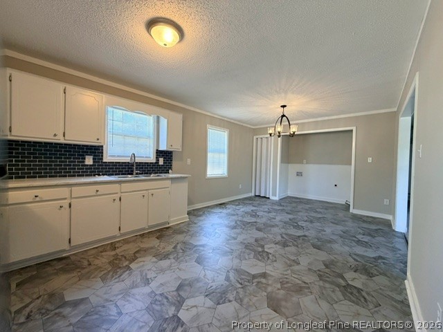 250 Trapper Run Lane Clinton, NC 28328 - Photo 12 of 22 a kitchen with granite countertop a sink and cabinets