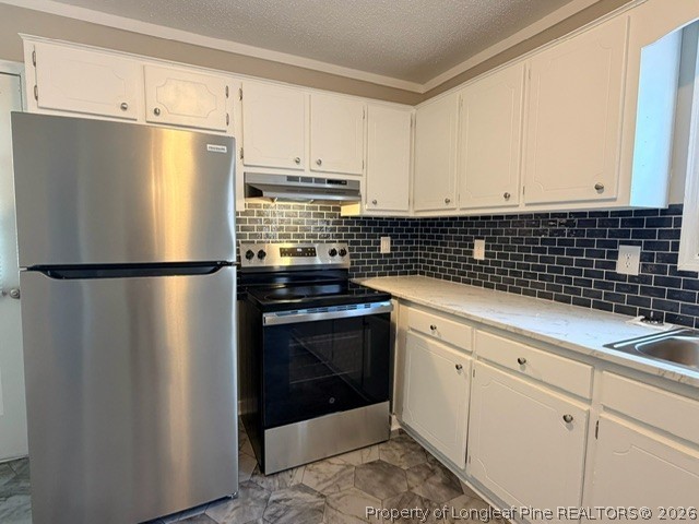 250 Trapper Run Lane Clinton, NC 28328 - Photo 7 of 22 a kitchen with a refrigerator and white cabinets