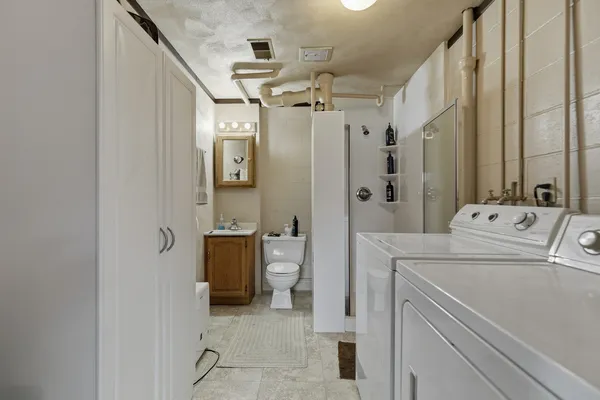 a utility room with dryer and washer
