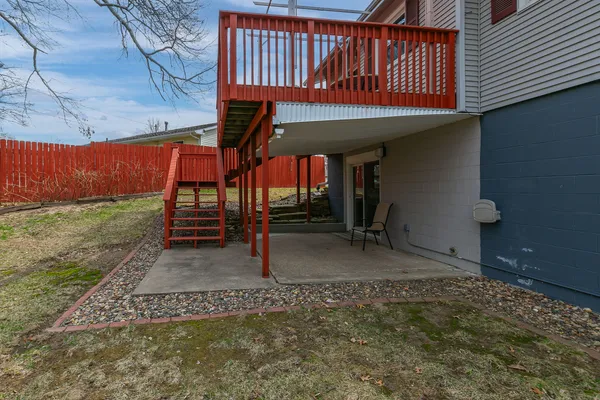 a balcony with wooden floor and outdoor space