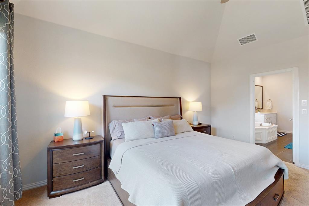 1997 Kieva Place Allen, TX 75013 - Photo 16 of 40 Bedroom featuring light carpet, ensuite bathroom, and vaulted ceiling