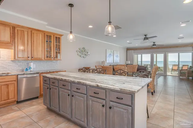 a bedroom with a large bed and a large window