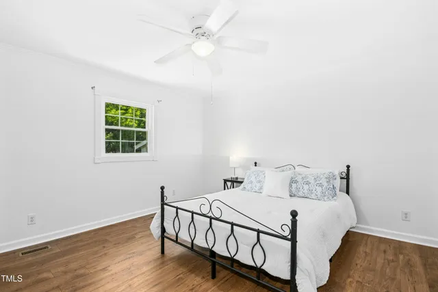 a bed room with a bed and a window