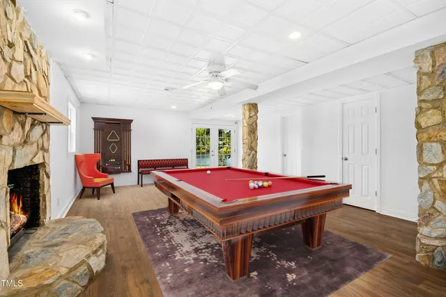 a room with furniture and pool table