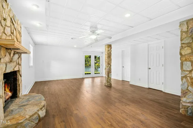 a view of livingroom with hardwood floor and a fireplace