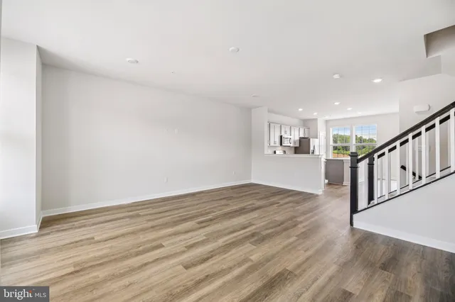 a view of an entryway with wooden floor