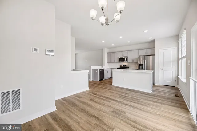 a view of kitchen with wooden floor and window