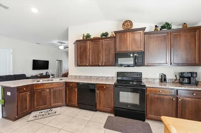 a bedroom with furniture and a flat screen tv