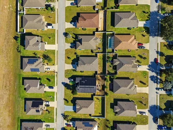 an aerial view of a building with traffic signal lights