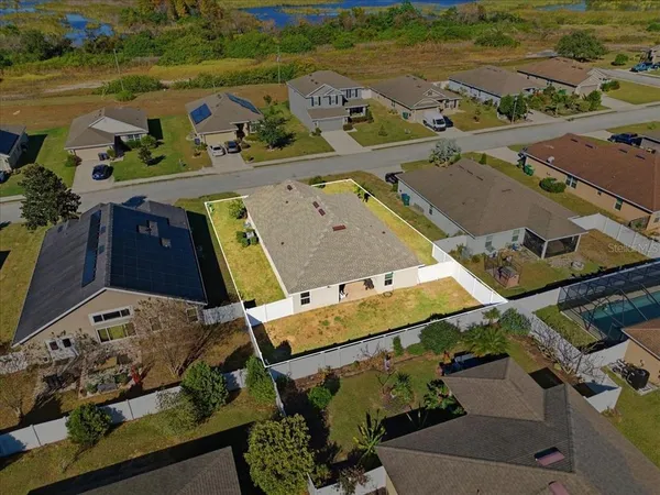 an aerial view of a houses with outdoor space