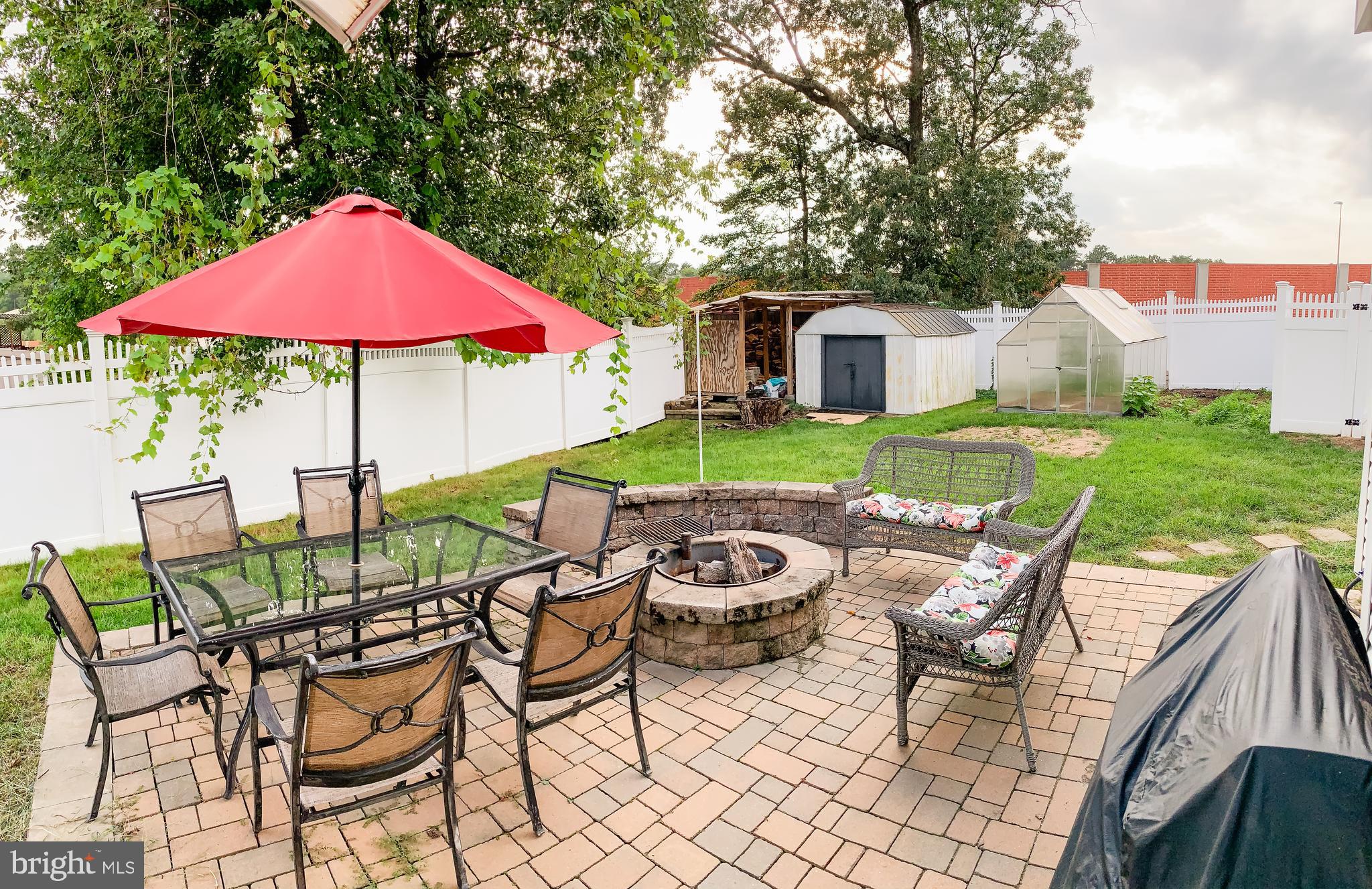 7807 Hooes Road Springfield, VA 22152 - Photo 58 of 61 Beautiful fenced backyard with a patio