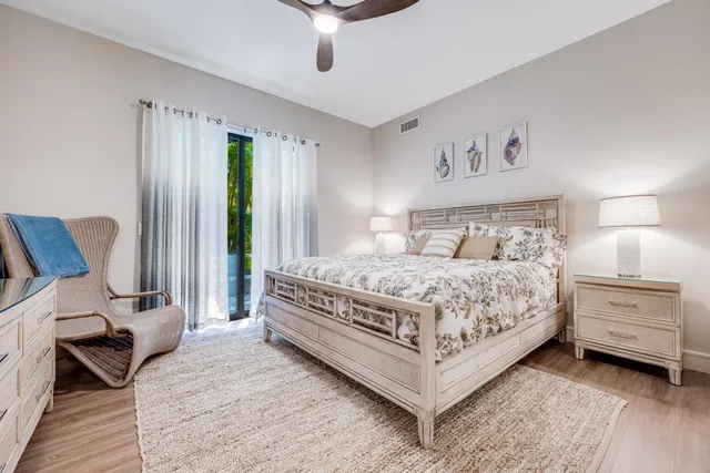 a bedroom with a bed and a chair