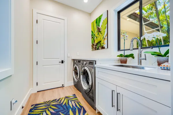 a utility room with window dryer and washer