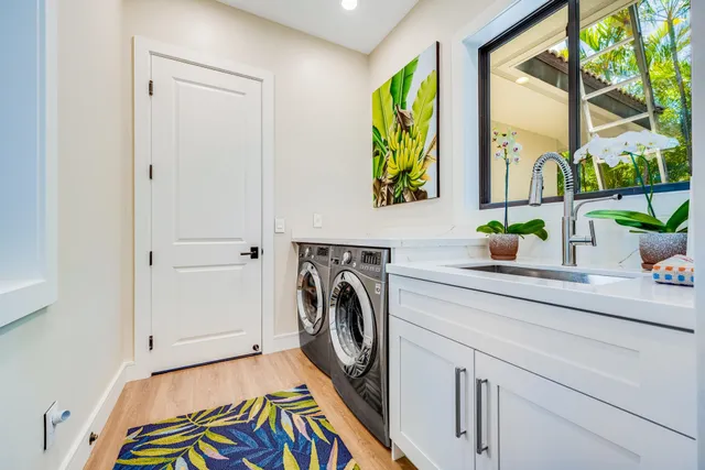 a utility room with window dryer and washer