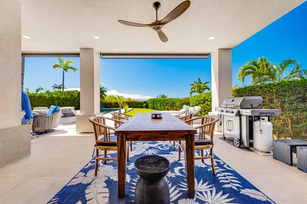 a living room with furniture a rug and a chandelier
