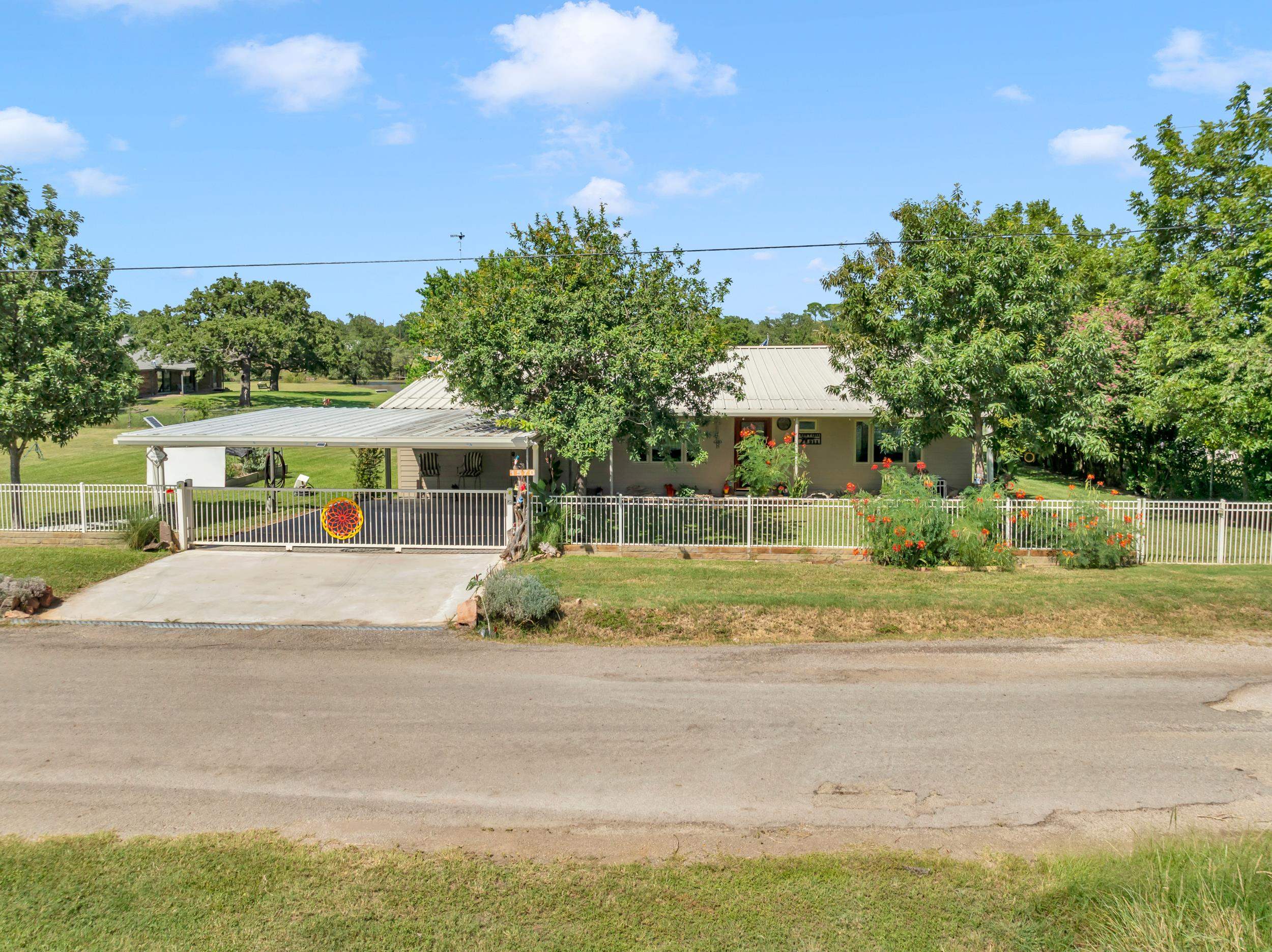 1570 Breezeway Tow, TX 78672 - Photo 2 of 30 a view of house with outdoor space and street