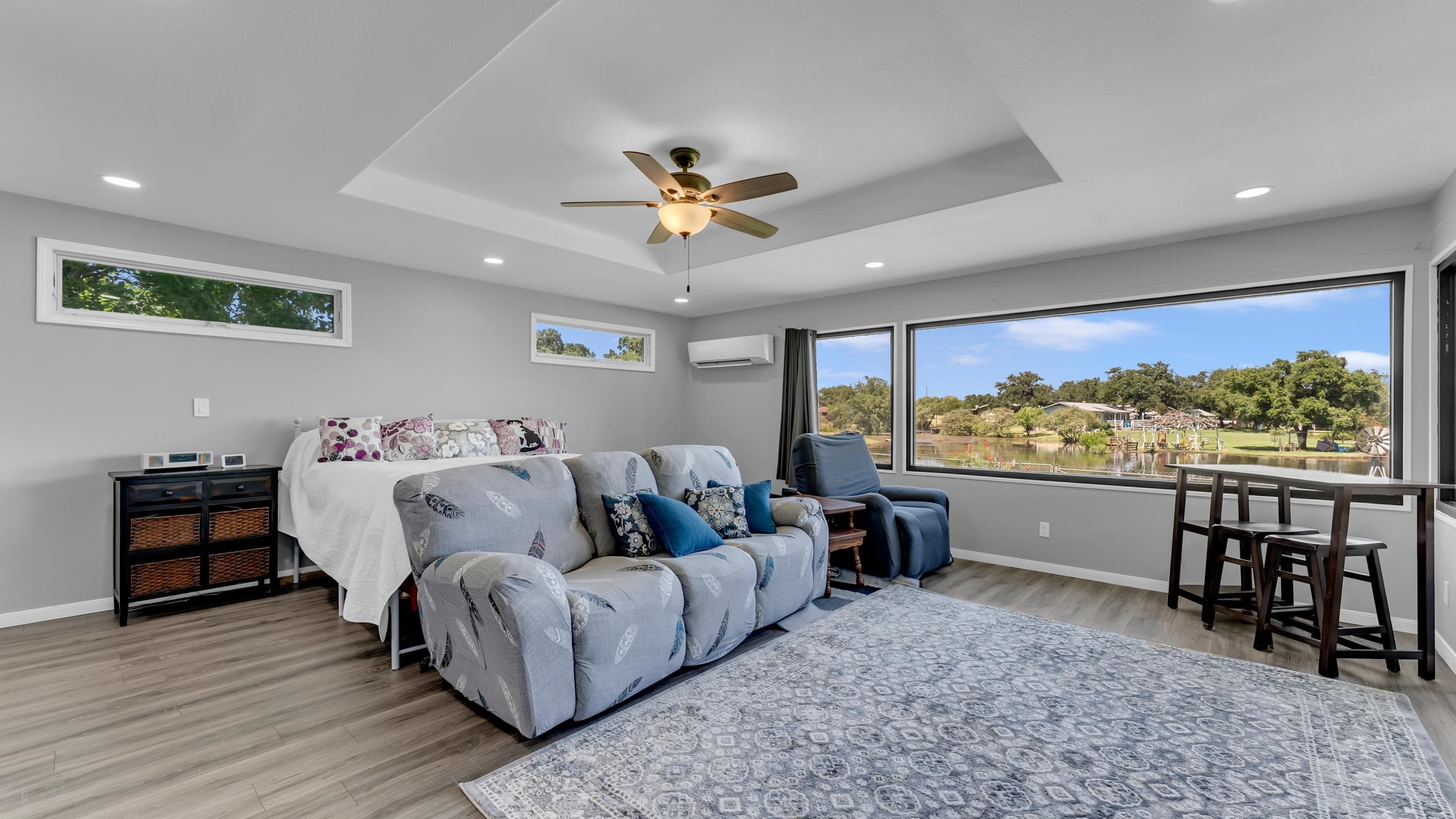 1570 Breezeway Tow, TX 78672 - Photo 9 of 30 a living room with furniture a rug and wooden floor