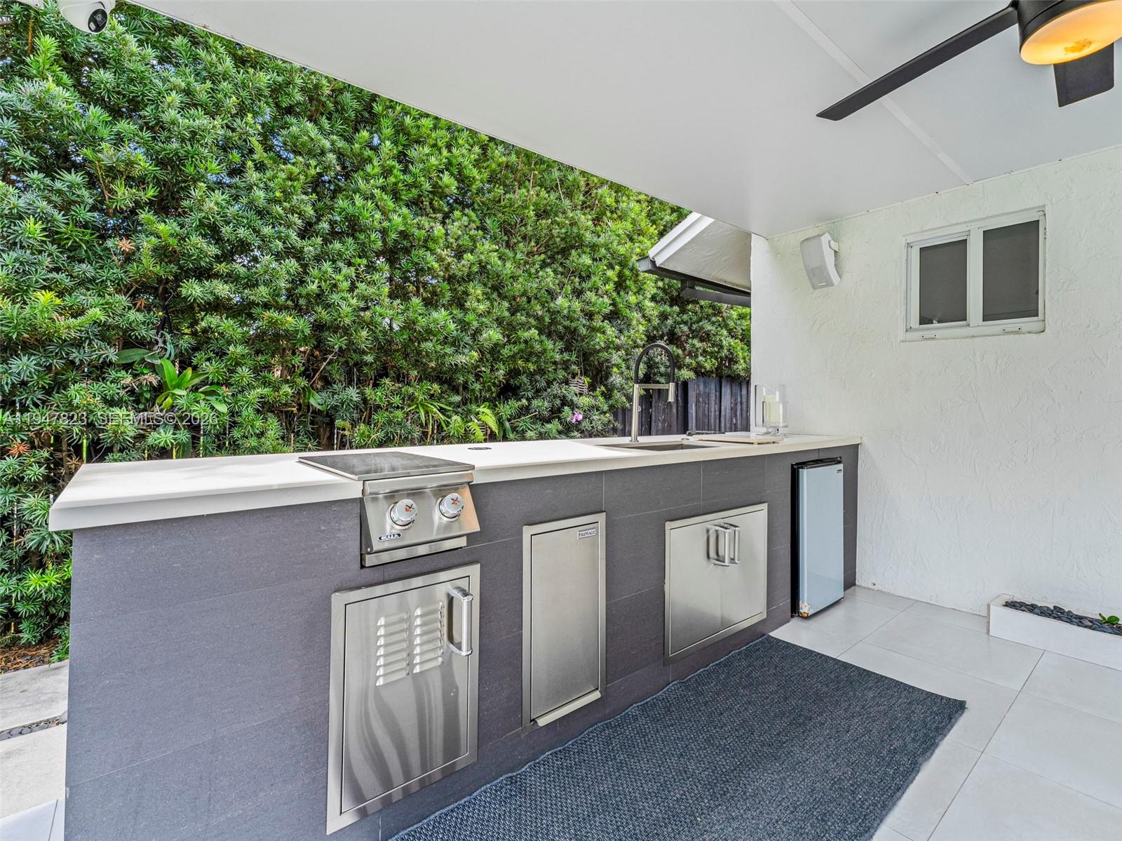 7753 Northwest 189th Street, Unit 1 Hialeah, FL 33015 - Photo 12 of 30 a view of a two chairs in the balcony