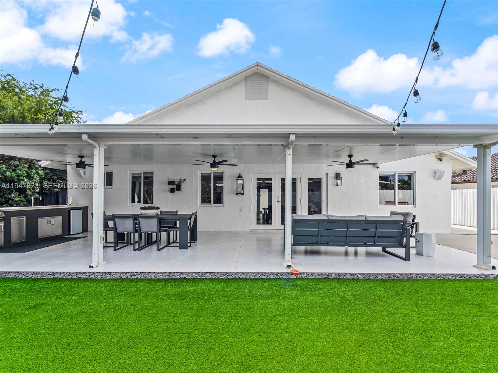 7753 Northwest 189th Street, Unit 1 Hialeah, FL 33015 - Photo 20 of 30 a view of outdoor space yard and patio