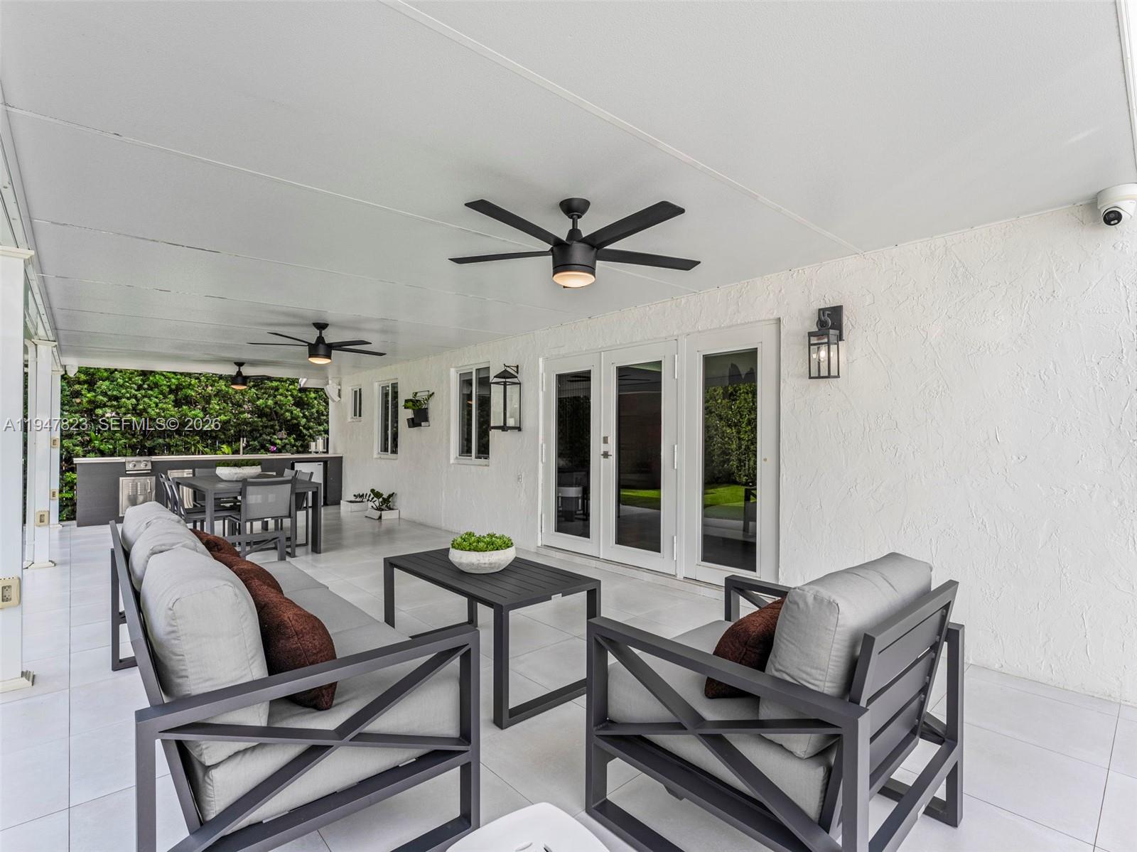 7753 Northwest 189th Street, Unit 1 Hialeah, FL 33015 - Photo 23 of 30 a living room with furniture
