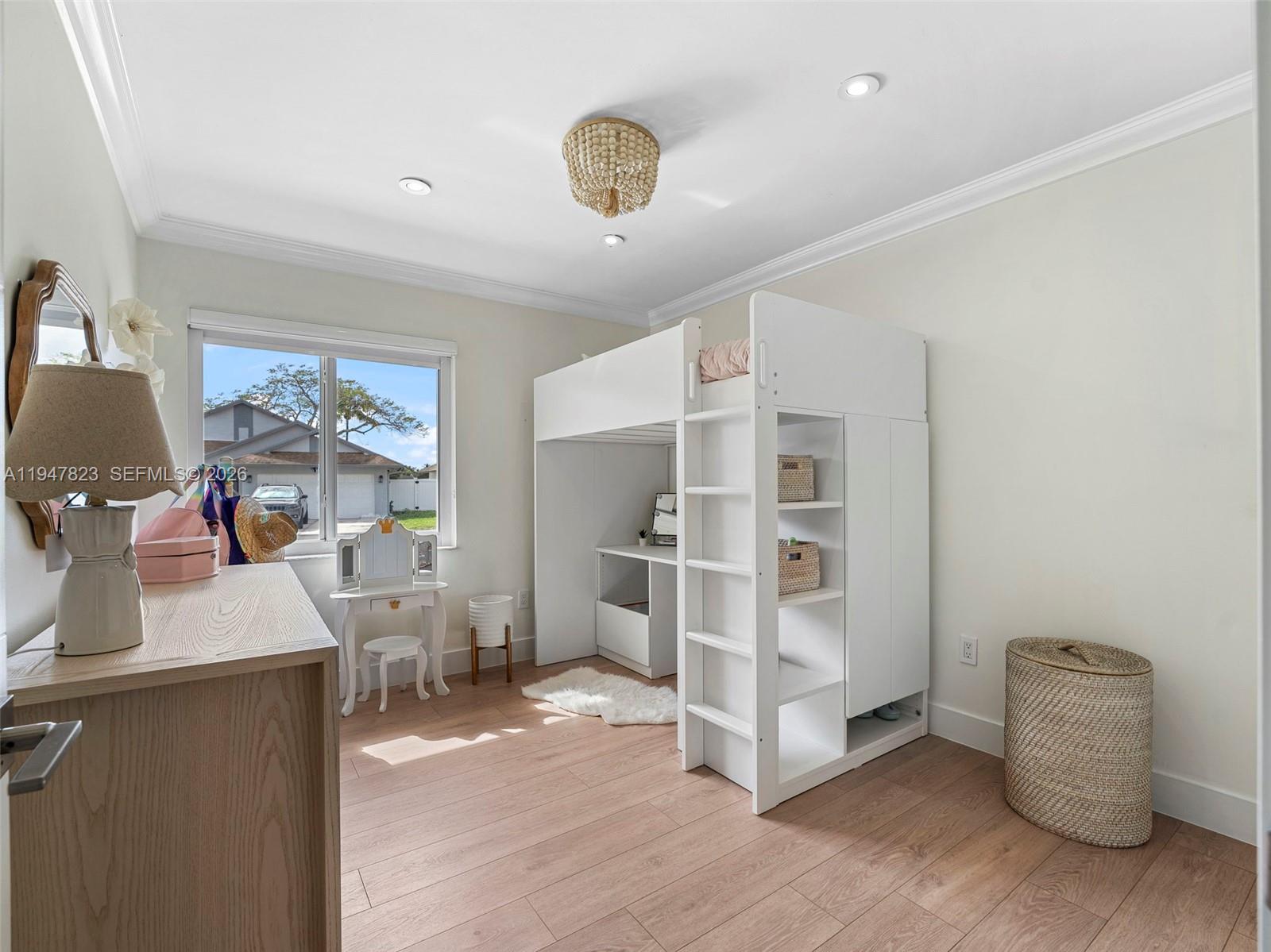 7753 Northwest 189th Street, Unit 1 Hialeah, FL 33015 - Photo 29 of 30 a room with furniture and a window