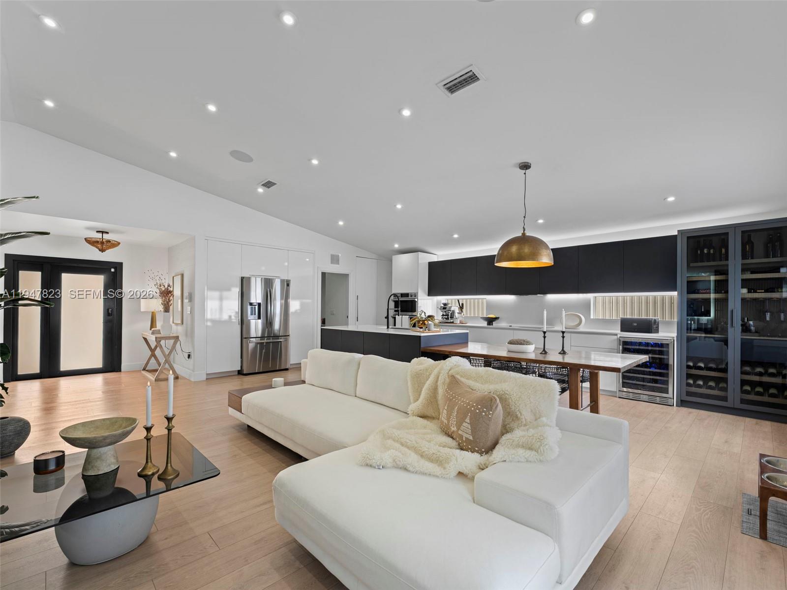 7753 Northwest 189th Street, Unit 1 Hialeah, FL 33015 - Photo 6 of 30 a living room with furniture and a large window