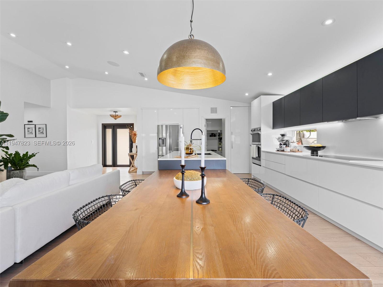 7753 Northwest 189th Street, Unit 1 Hialeah, FL 33015 - Photo 9 of 30 a swimming pool with view of kitchen and dining room