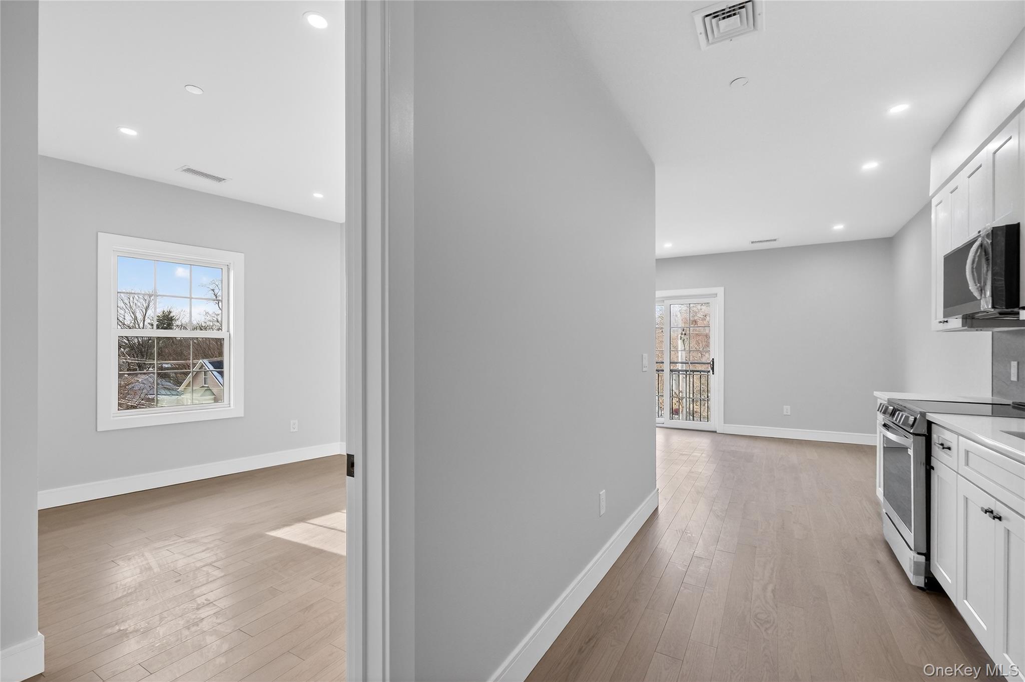 10 Market Street, Unit J Wappingers Falls, NY 12590 - Photo 4 of 18 a view of a kitchen with a sink a refrigerator and window