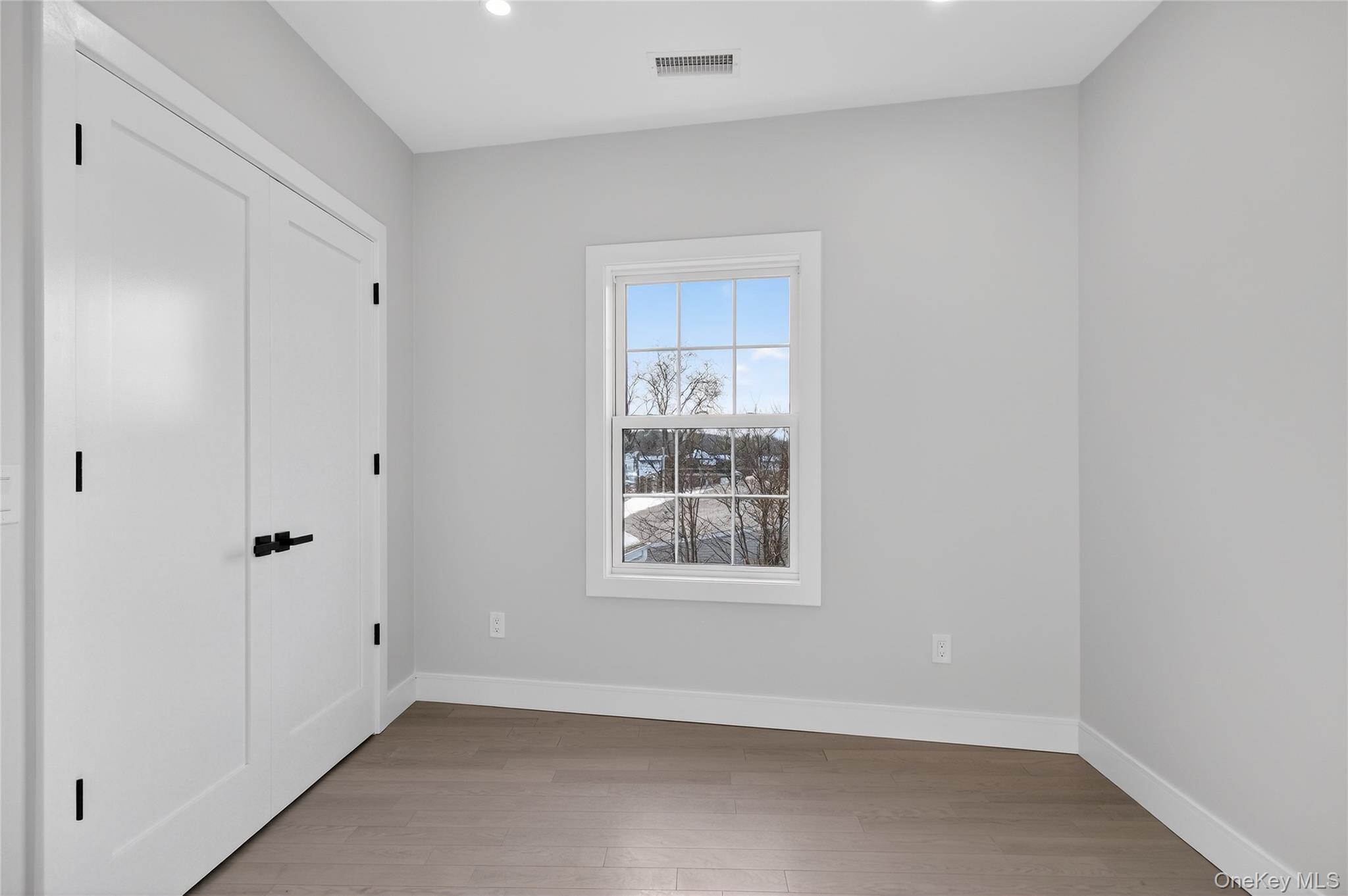 10 Market Street, Unit J Wappingers Falls, NY 12590 - Photo 6 of 18 a view of an empty room with a window