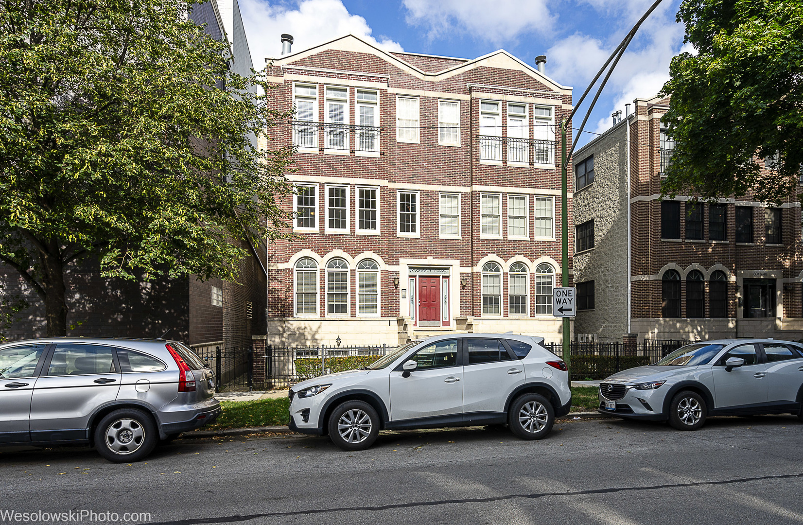 3042 North Oakley Avenue, Unit 2S Chicago, IL 60618 - Photo 1 of 19 a car parked in front of a house