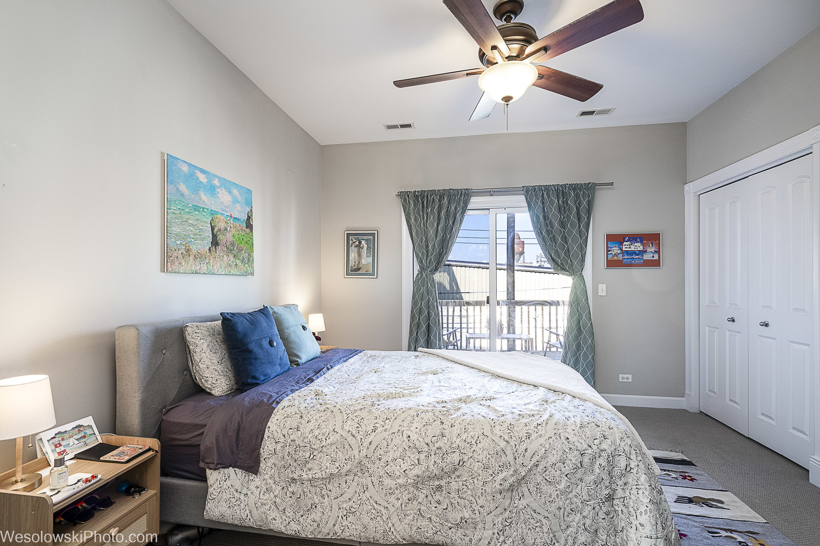 3042 North Oakley Avenue, Unit 2S Chicago, IL 60618 - Photo 13 of 19 a bedroom with a bed and a chandelier