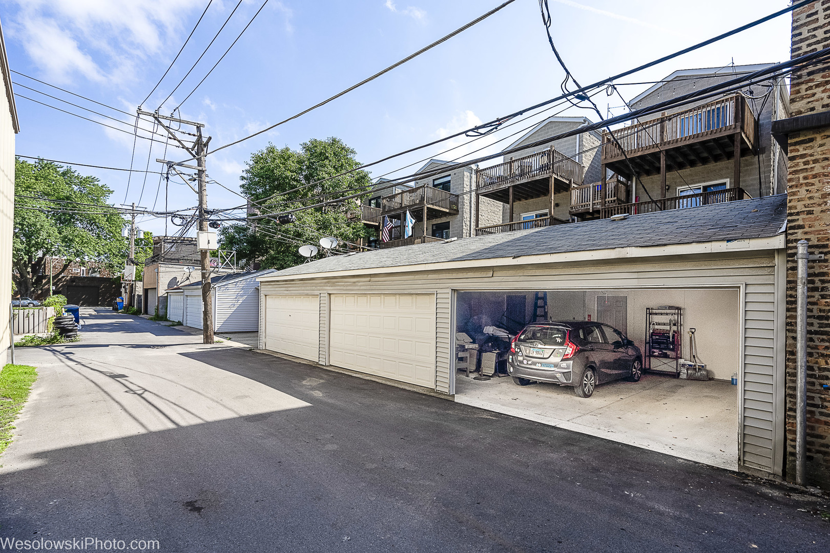 3042 North Oakley Avenue, Unit 2S Chicago, IL 60618 - Photo 19 of 19 a car parked in front of a building