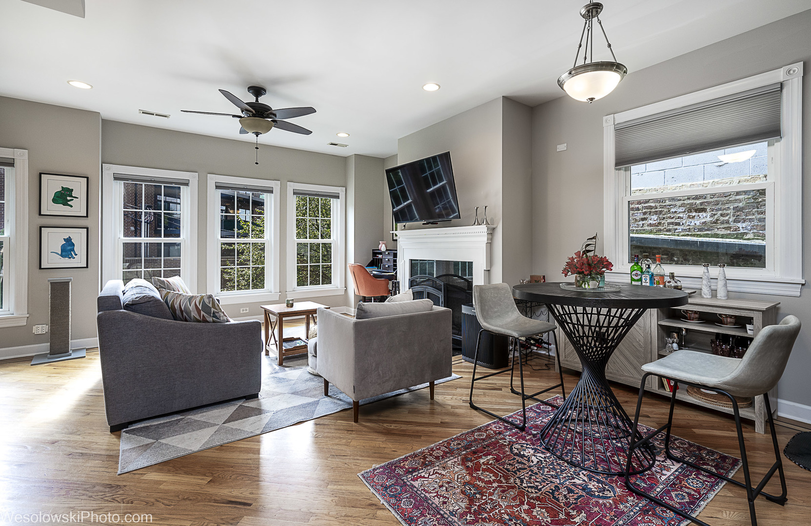 3042 North Oakley Avenue, Unit 2S Chicago, IL 60618 - Photo 4 of 19 a living room with furniture a fireplace and a flat screen tv